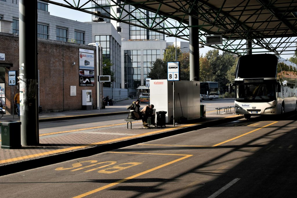 White bus on a Lampugnano FlixBus Bus Stop in Milano, Italy